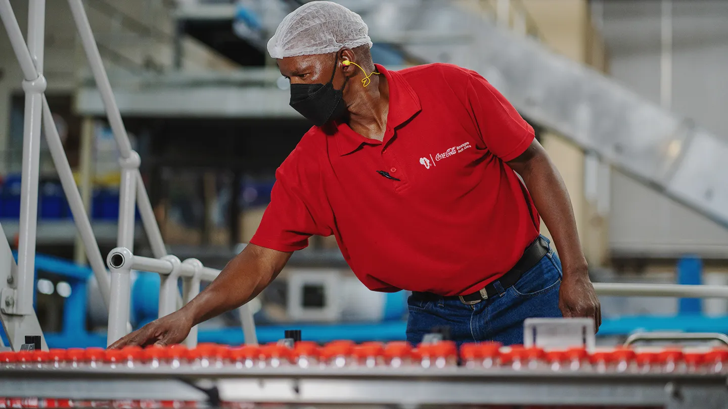 worker at a cocacola bottling factory